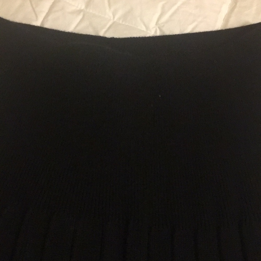 Skirt-pleated.  MedNice large band to the pleats